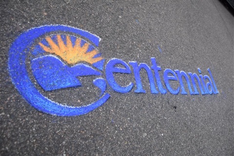 City logo in chalk on asphalt