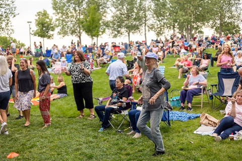 People enjoying live music at Centennial Center Park