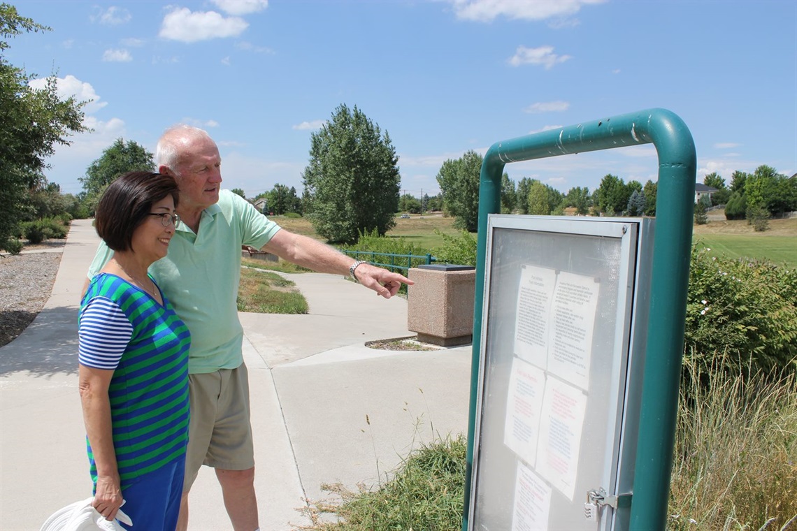 couple at park sign