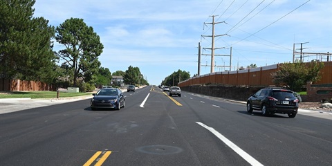 Cars driving on a newly paved street