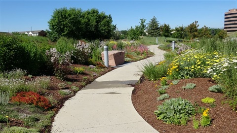 Walking trail with flowers and greenery