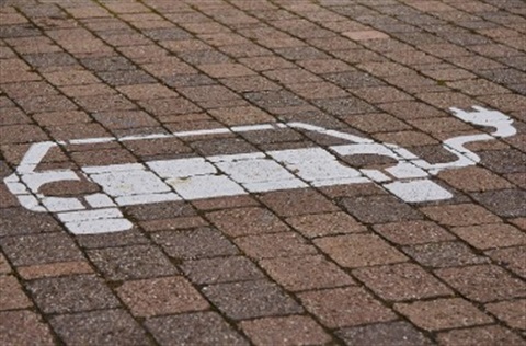 Chalk Car with Electric Plug on Brick Tiles