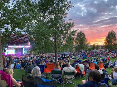 Large crowd at City of Centennial Event at Centennial Center Park Amphitheatre at sunset
