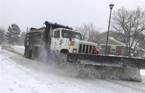 snow plow on residential street