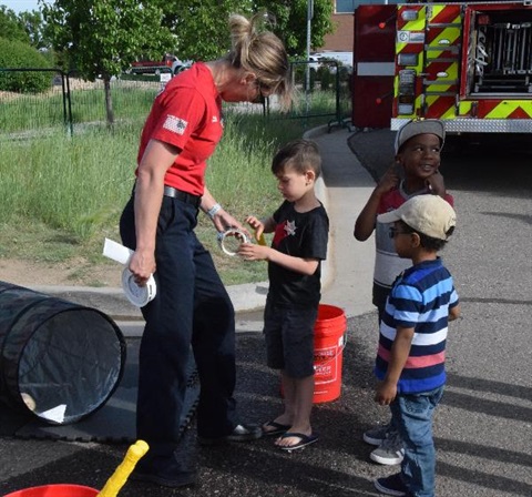 children with South Metro Fire person